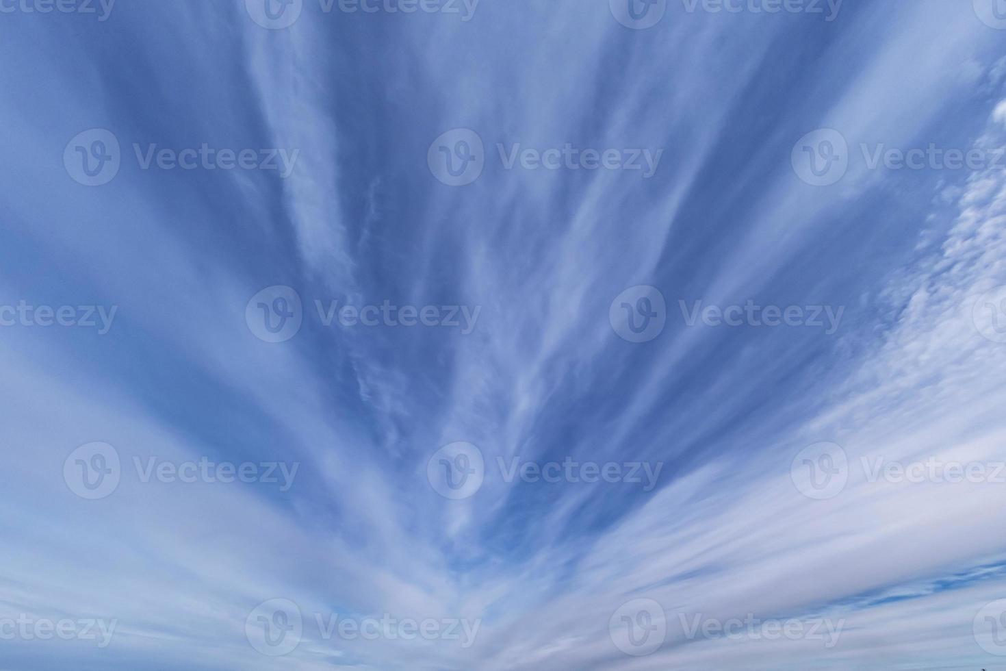 dark Blue sky background with tiny stratus cirrus striped clouds. Clearing evening and Good windy weather photo