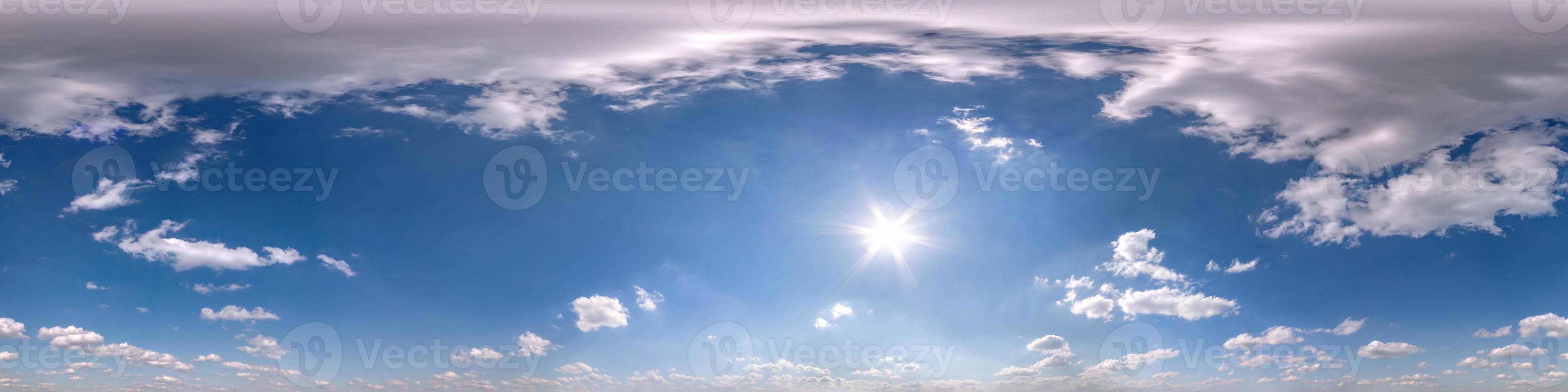 blue sky with beautiful fluffy cumulus clouds. Seamless hdri panorama 360 degrees angle view without ground for use in 3d graphics or game development as sky dome or edit drone shot photo