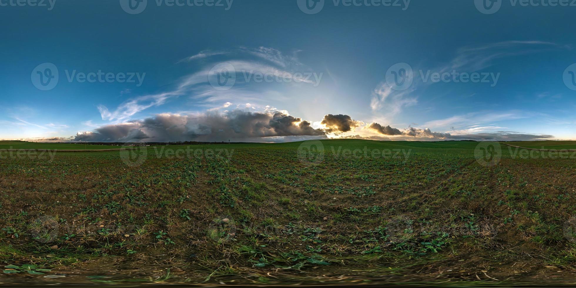 full seamless spherical hdr panorama 360 degrees angle view among fields with awesome black clouds before storm in equirectangular projection, VR AR virtual reality content with zenith photo