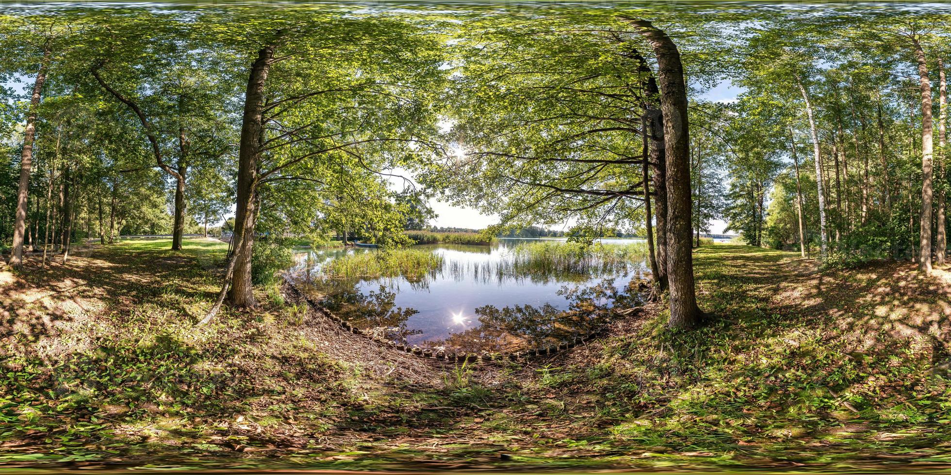 full seamless spherical hdri panorama 360 degrees angle view on pedestrian walking path among the bushes of forest near river or lake in equirectangular projection, ready VR AR virtual reality content photo