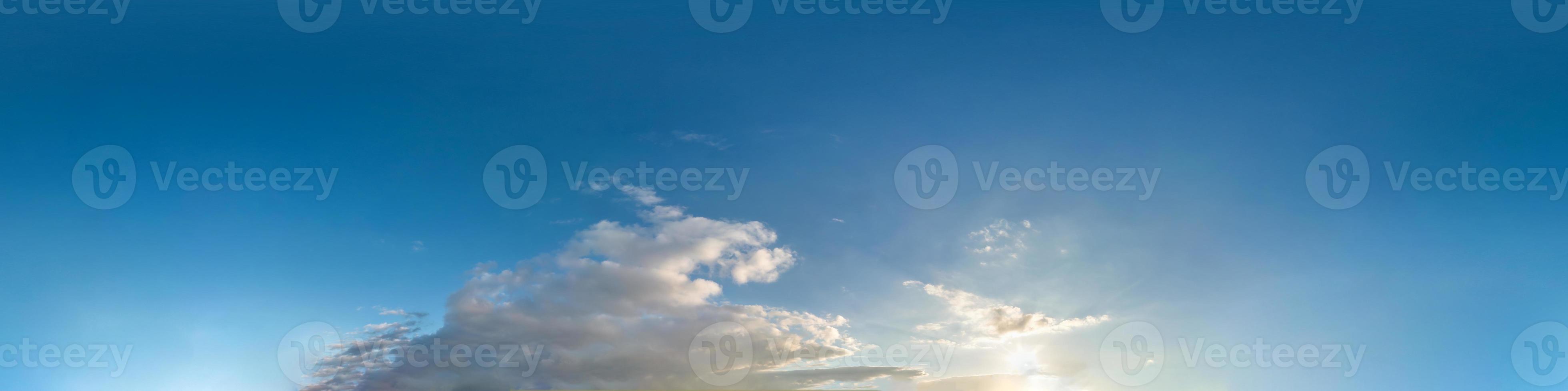 beautiful clouds in blue sky with evening sun. Seamless hdri panorama 360 degrees angle view  with zenith for use in 3d graphics or game development as sky dome or edit drone shot photo