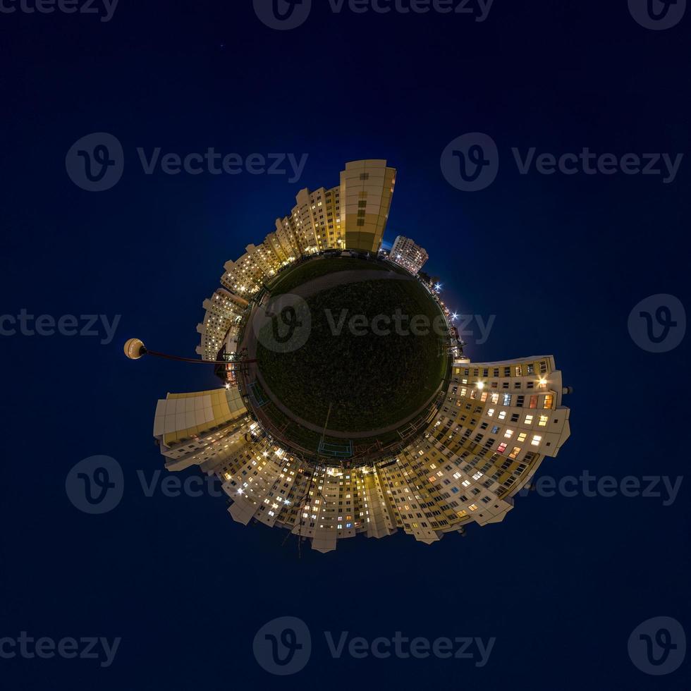 Little planet transformation of spherical panorama 360 degrees. Spherical abstract aerial night view multi-storey buildings. Curvature of space. photo