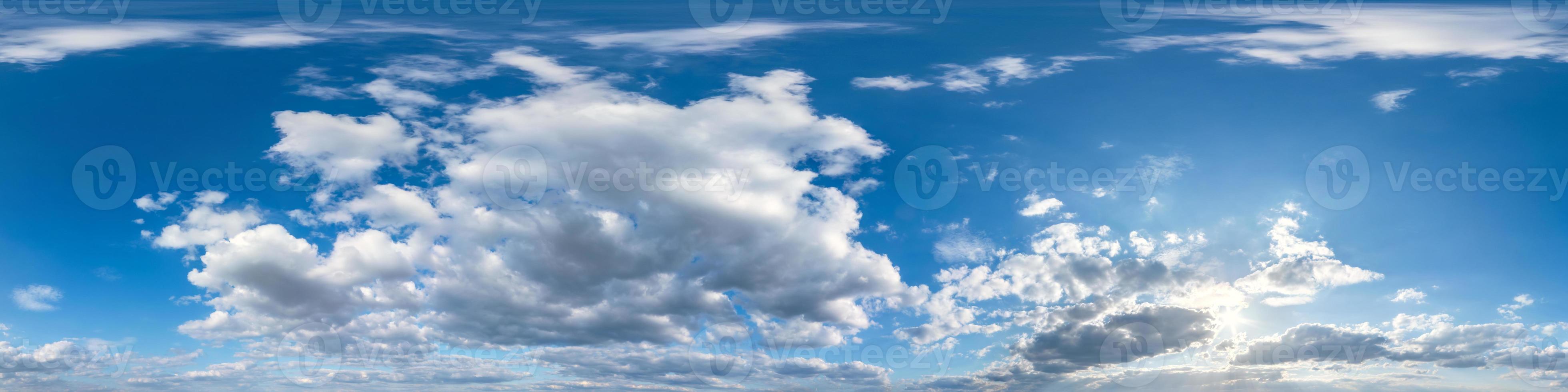 Seamless hdri panorama 360 degrees angle view blue sky with beautiful fluffy cumulus clouds with zenith for use in 3d graphics or game development as sky dome or edit drone shot photo