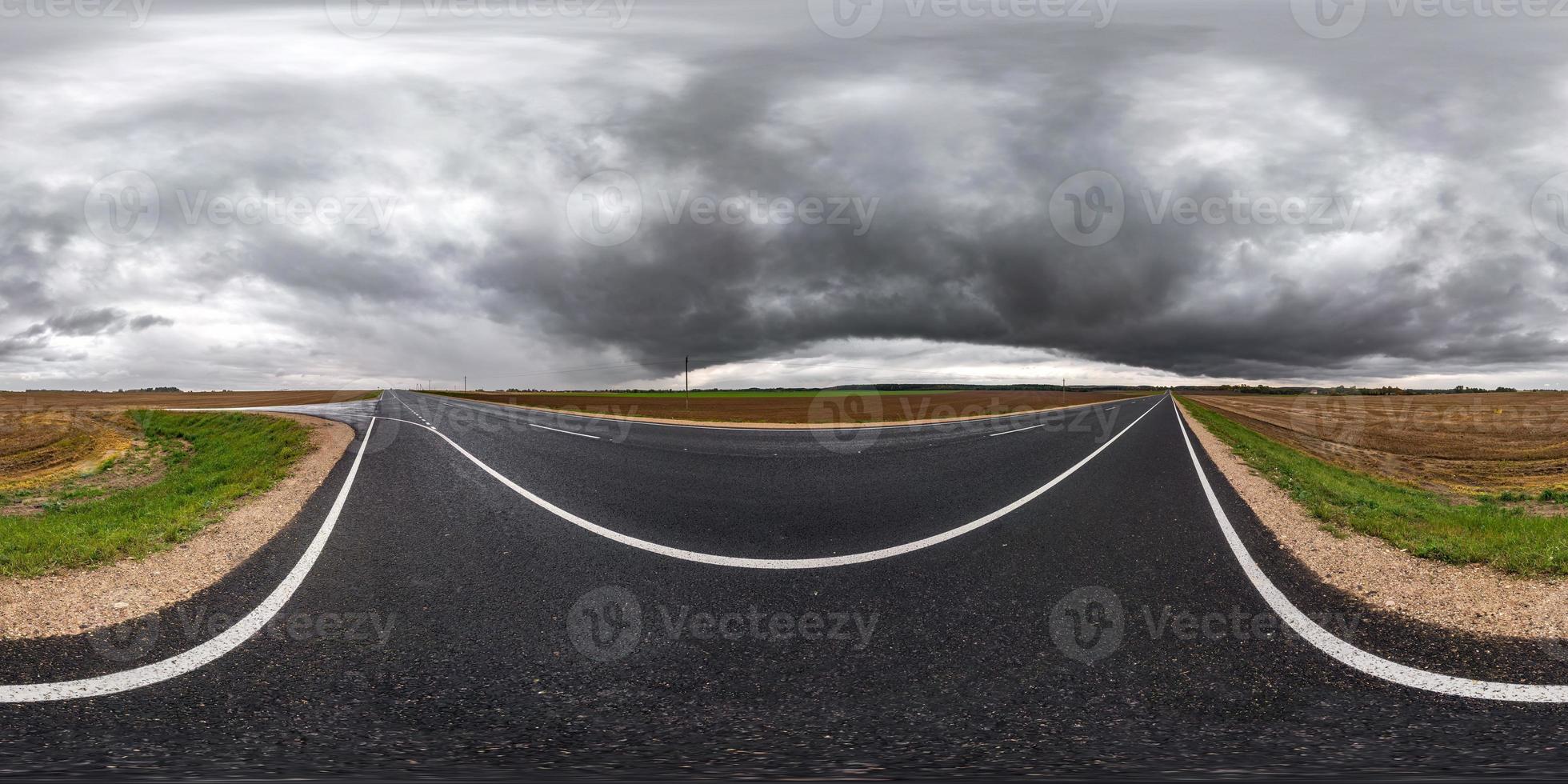 full seamless spherical hdri panorama 360 degrees angle view on asphalt road among fields in autumn day with beautiful clouds before storm in equirectangular projection, ready for VR AR content photo