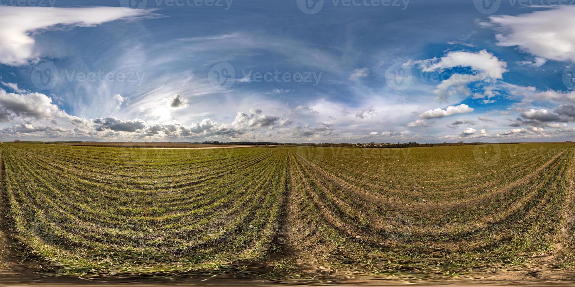 full seamless spherical hdri panorama 360 degrees angle view on among fields in spring day with awesome clouds in equirectangular projection, ready for VR AR virtual reality content photo