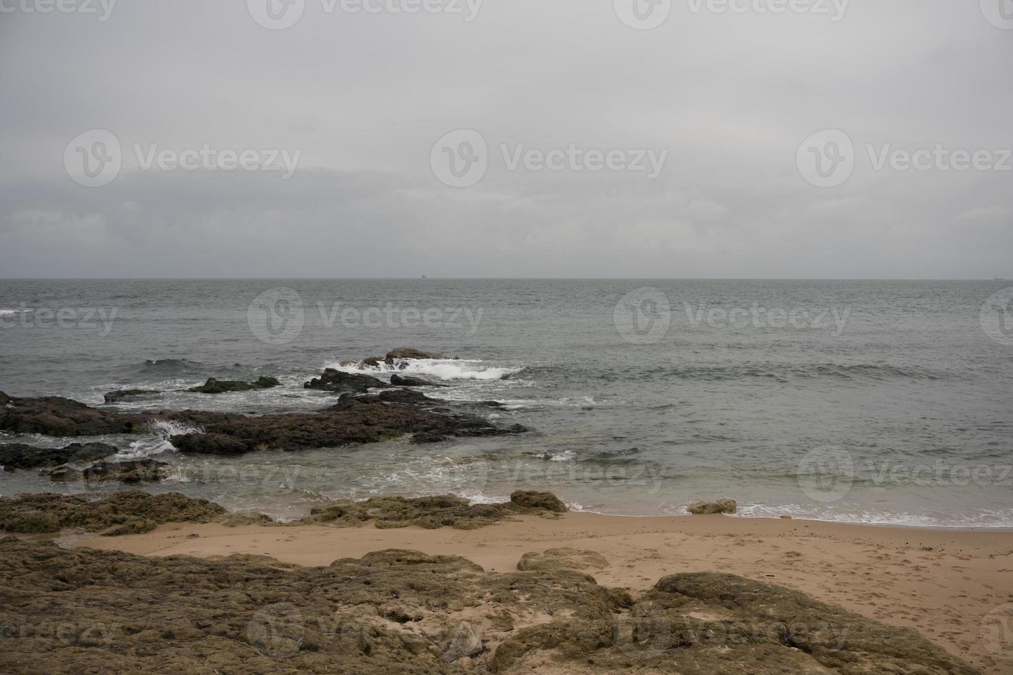 Peaceful beach scene with rocks photo