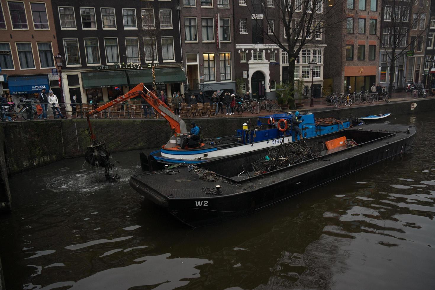Amsterdam, Netherlands, 2015 - Fishing bicycles out of Amsterdam canal photo