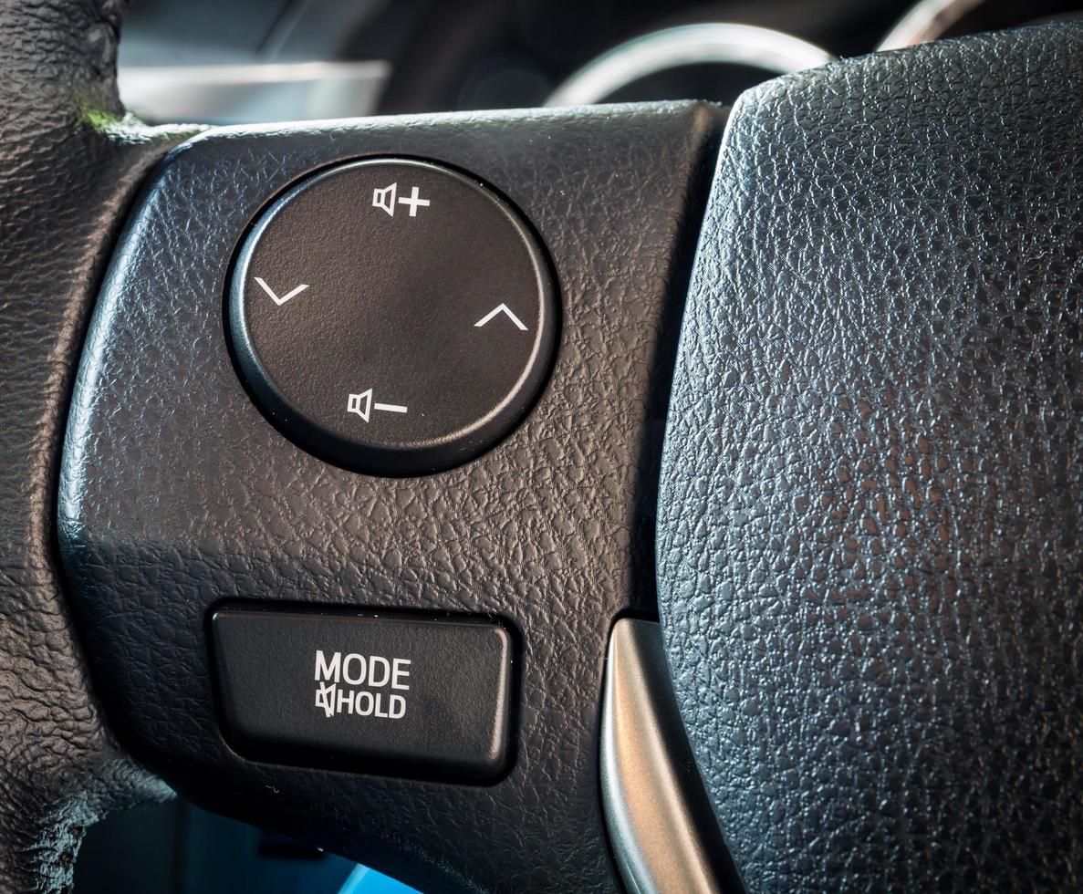 Modern car audio control multifunction buttons on a steering wheel photo