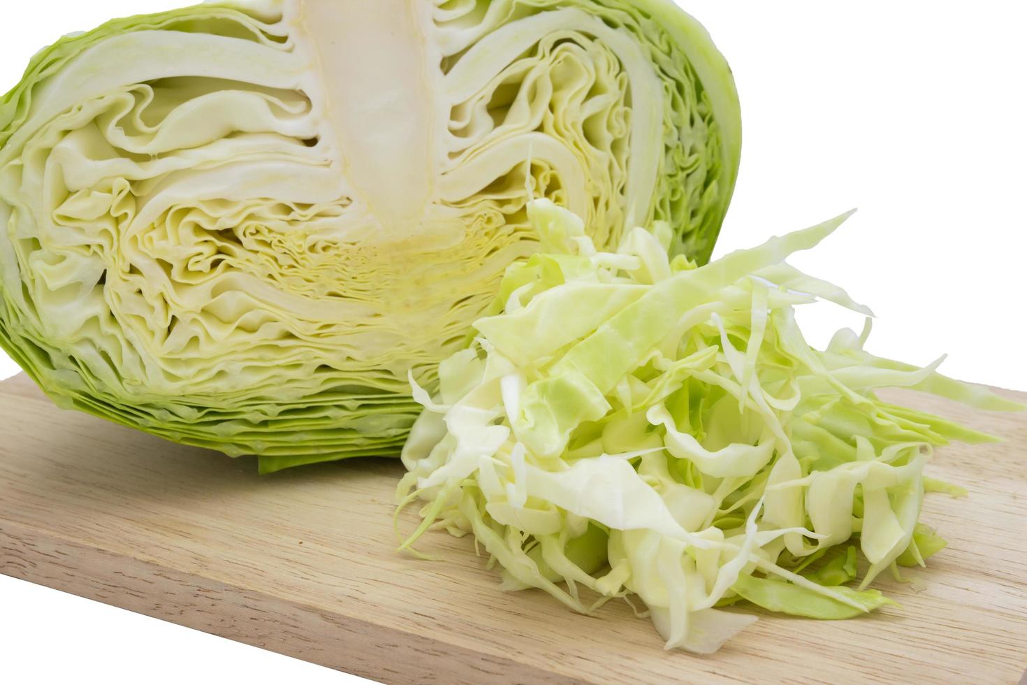 Closeup cabbage and cutted cabbage on wooden is isolated white background photo