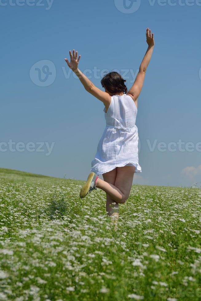 Young happy woman in green field photo