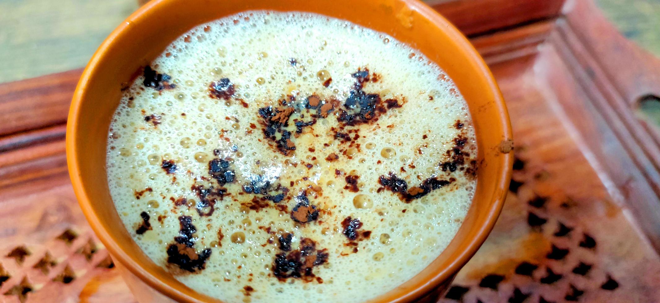 cup of fresh espresso on table, view from above photo