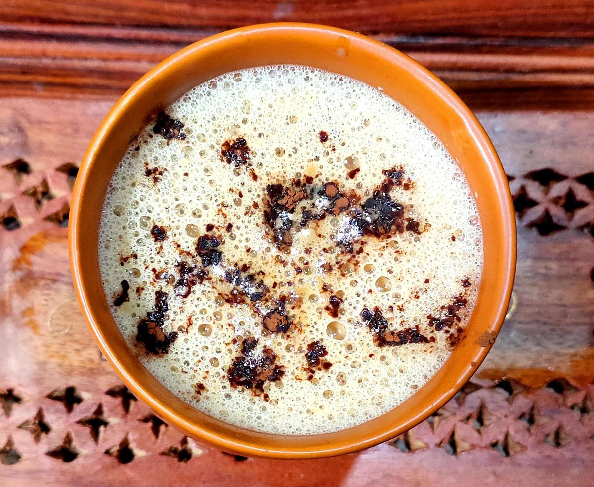 cup of fresh espresso on table, view from above photo