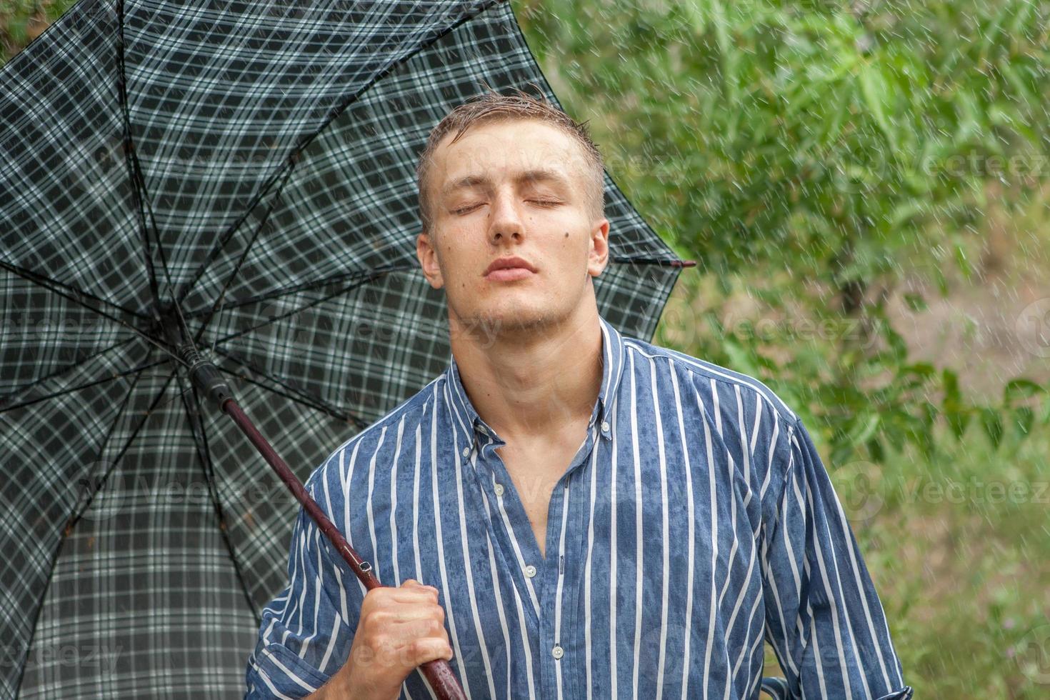 Man with umbrella in rain photo