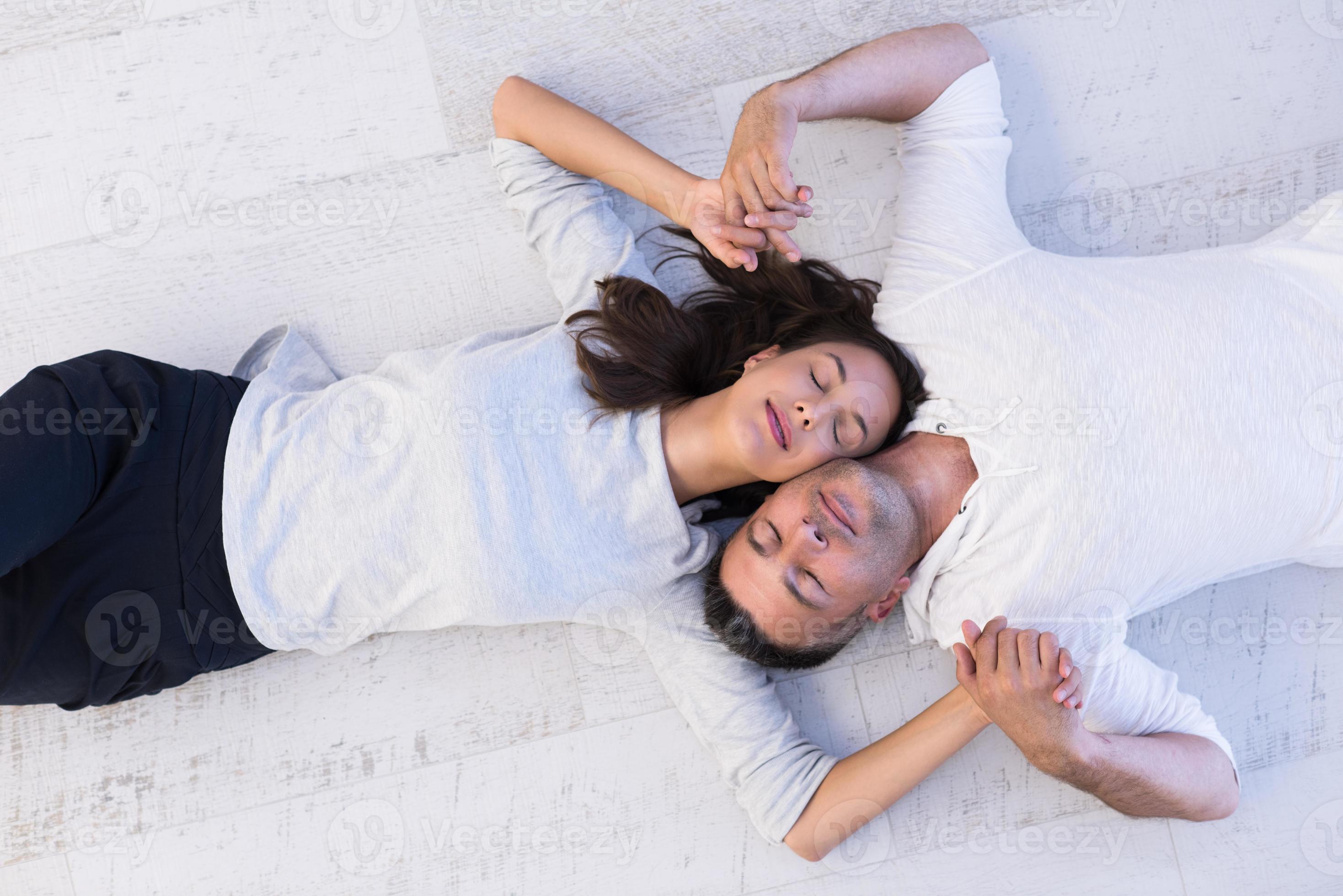 handsome couple lying on floor 10393273 Stock Photo at Vecteezy