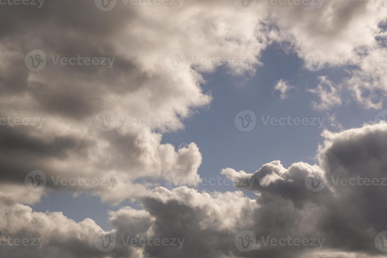 dark Blue sky background with tiny stratus cirrus striped clouds. Clearing evening and Good windy weather photo