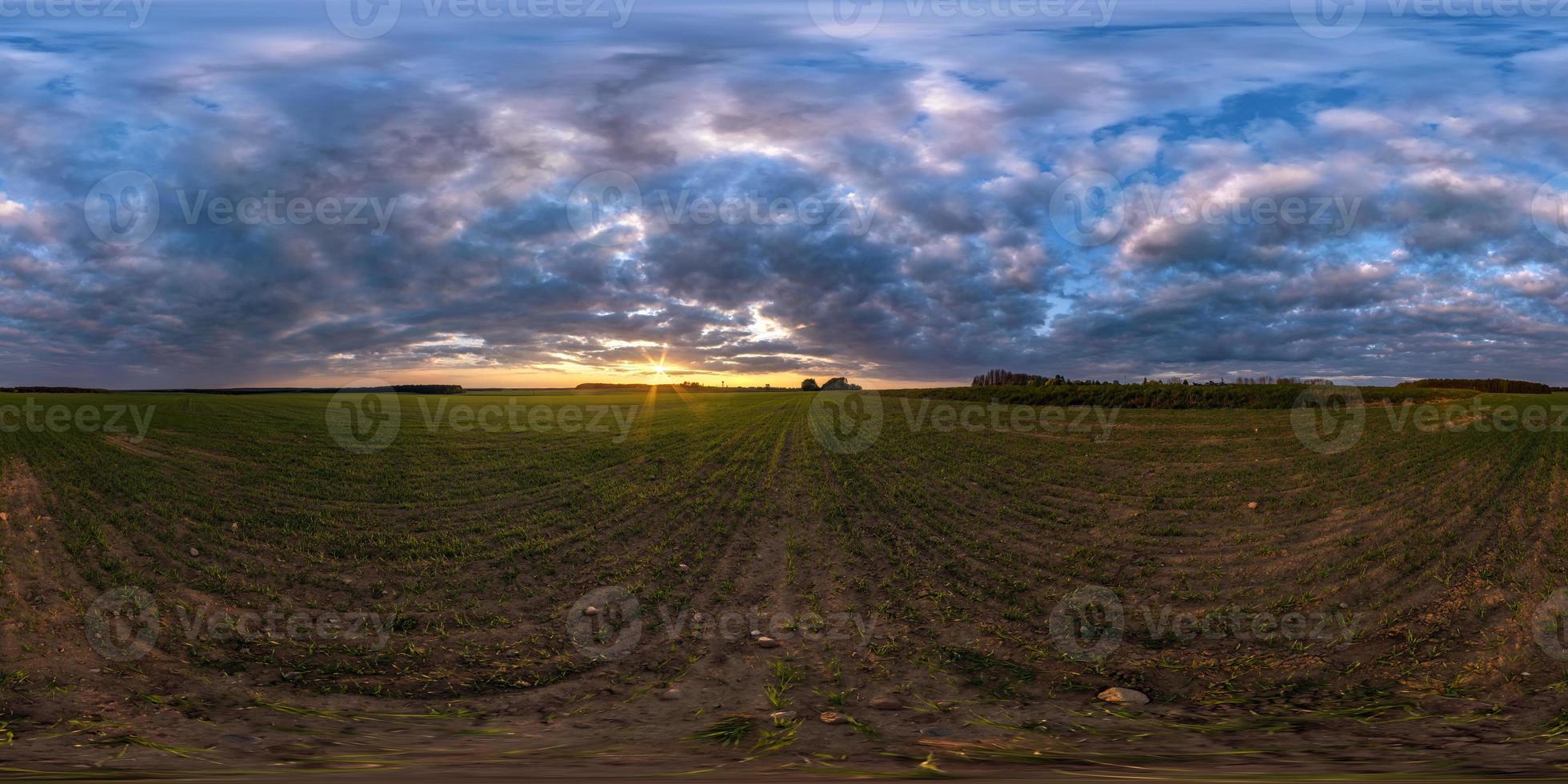 full seamless spherical hdri panorama 360 degrees angle view among fields in summer evening sunset with awesome blue pink red clouds in equirectangular projection, ready for VR AR virtual reality photo