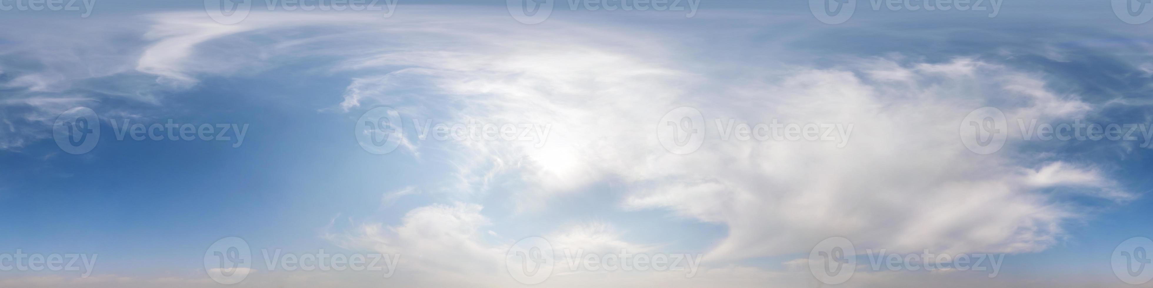 Seamless hdri panorama 360 degrees angle view blue sky with beautiful fluffy cumulus clouds without ground with zenith for use in 3d graphics or game development as sky dome or edit drone shot photo