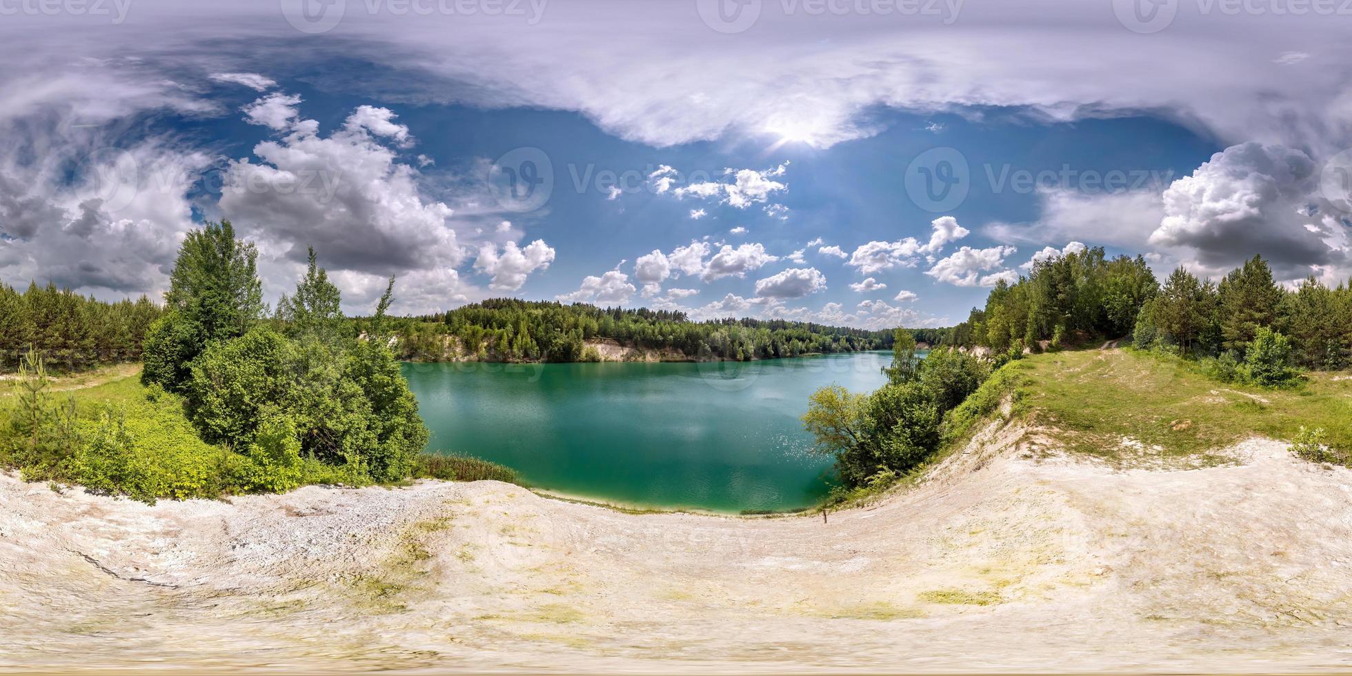 full seamless spherical hdri panorama 360 degrees angle view on limestone coast of huge green lake or river near forest in summer day with beautiful clouds in equirectangular projection, VR content photo