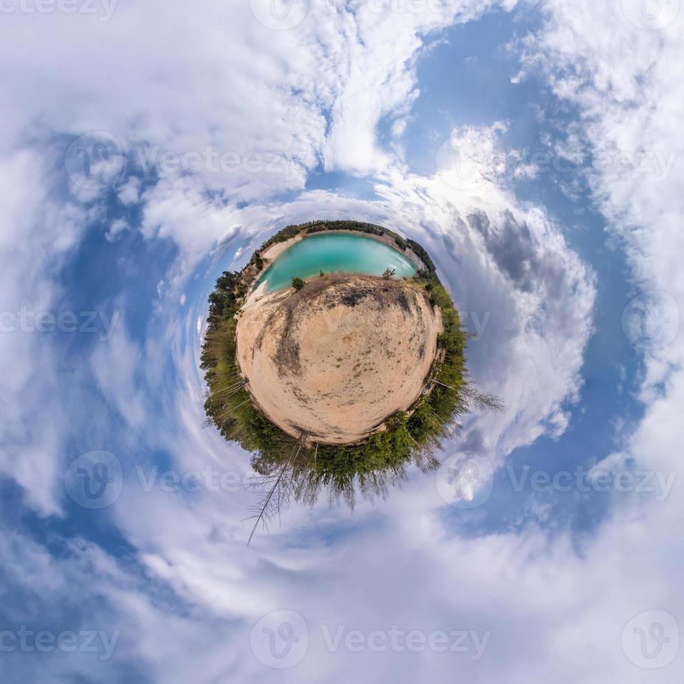 Little planet transformation of spherical panorama 360 degrees. Spherical abstract aerial view in field with awesome beautiful clouds. Curvature of space. photo