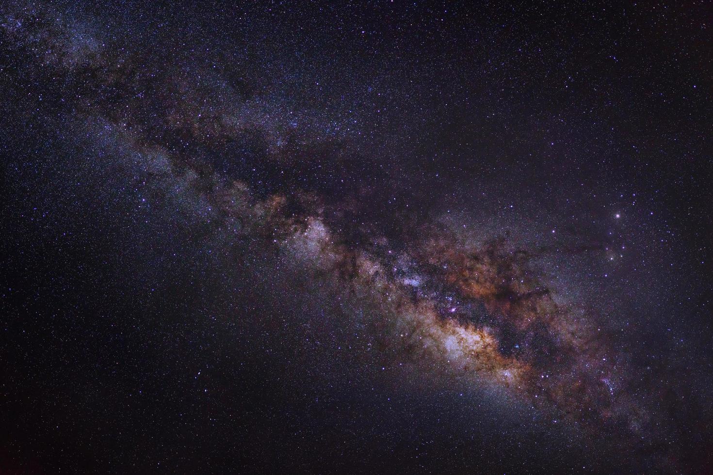 milky way galaxy on a night sky, long exposure photograph, with grain. photo