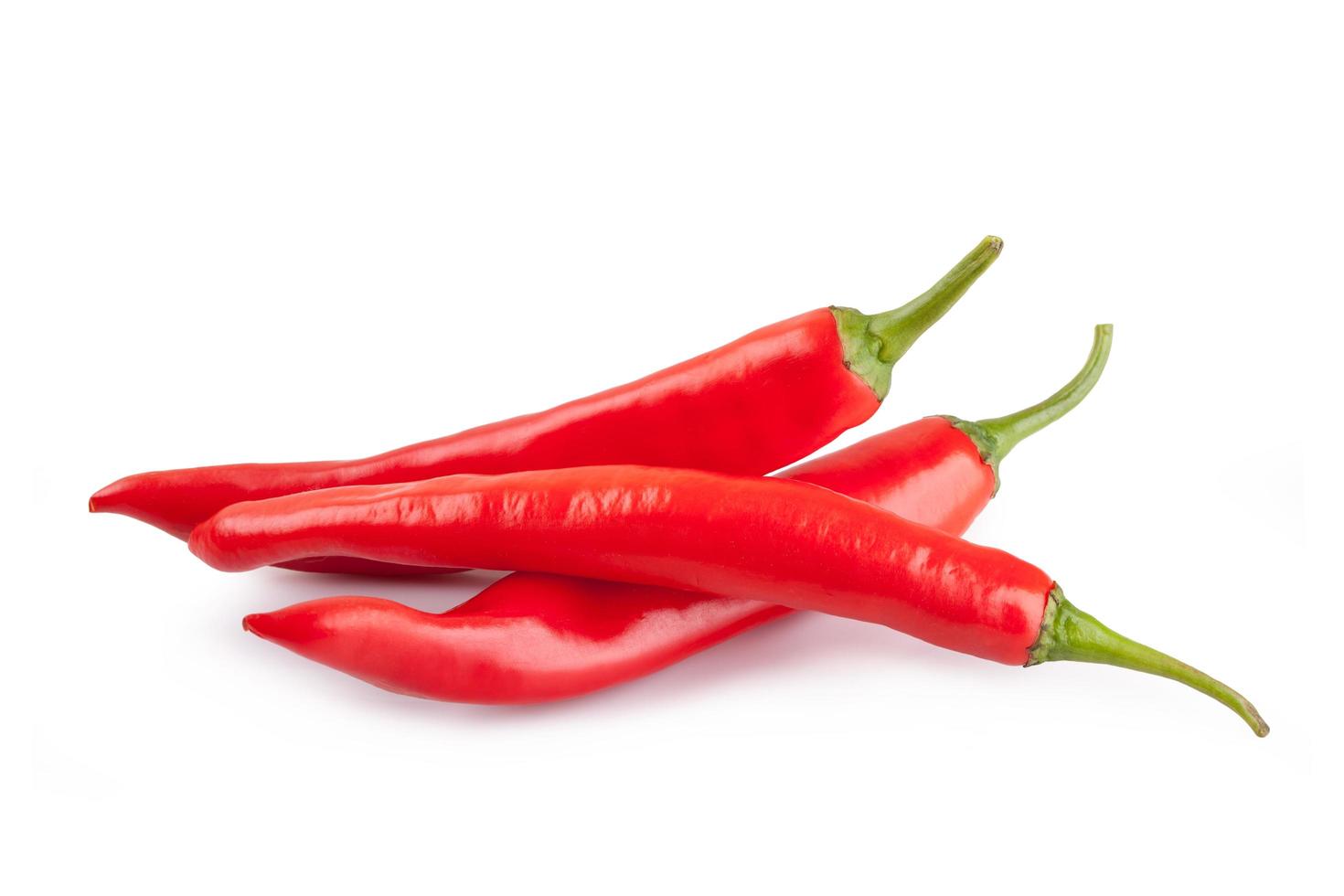 red chili or chilli cayenne pepper isolated on white background photo