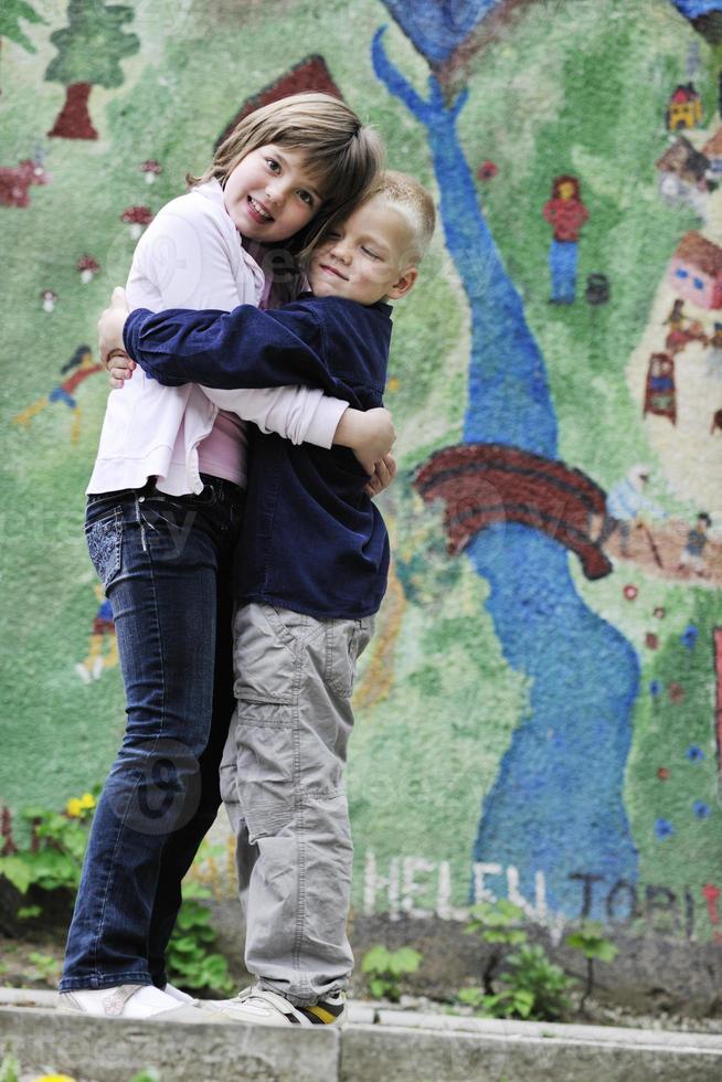 happy brother and sister outdoor in park photo