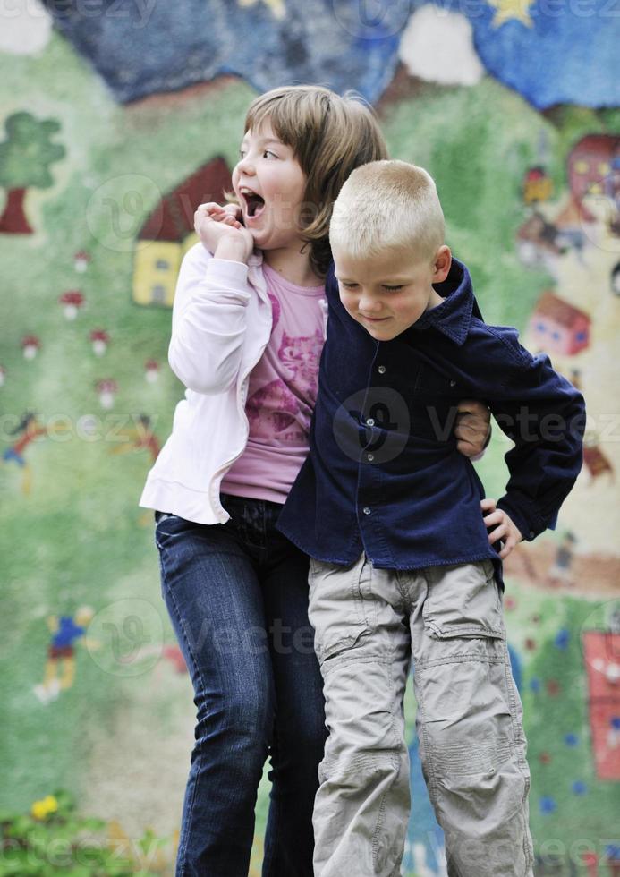 happy brother and sister outdoor in park photo