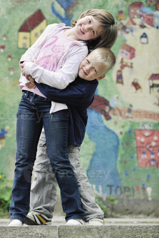 happy brother and sister outdoor in park photo