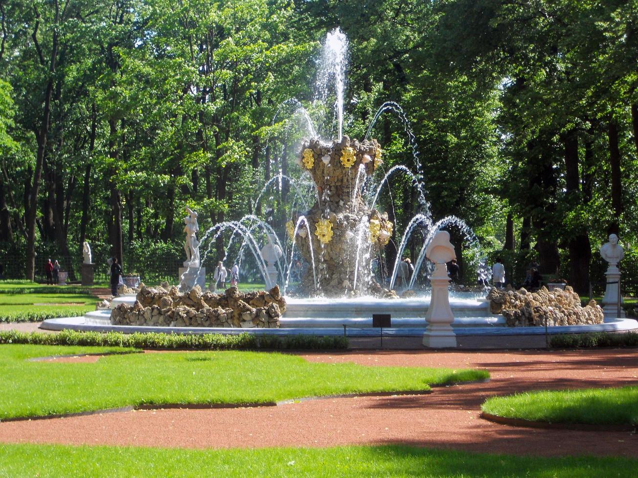 Crown Fountain in the Summer Garden. A picturesque place in the middle of the city. Amazing architecture. Freshness of a summer morning. Attraction of the city of St. Petersburg. Tourism. Travels. photo