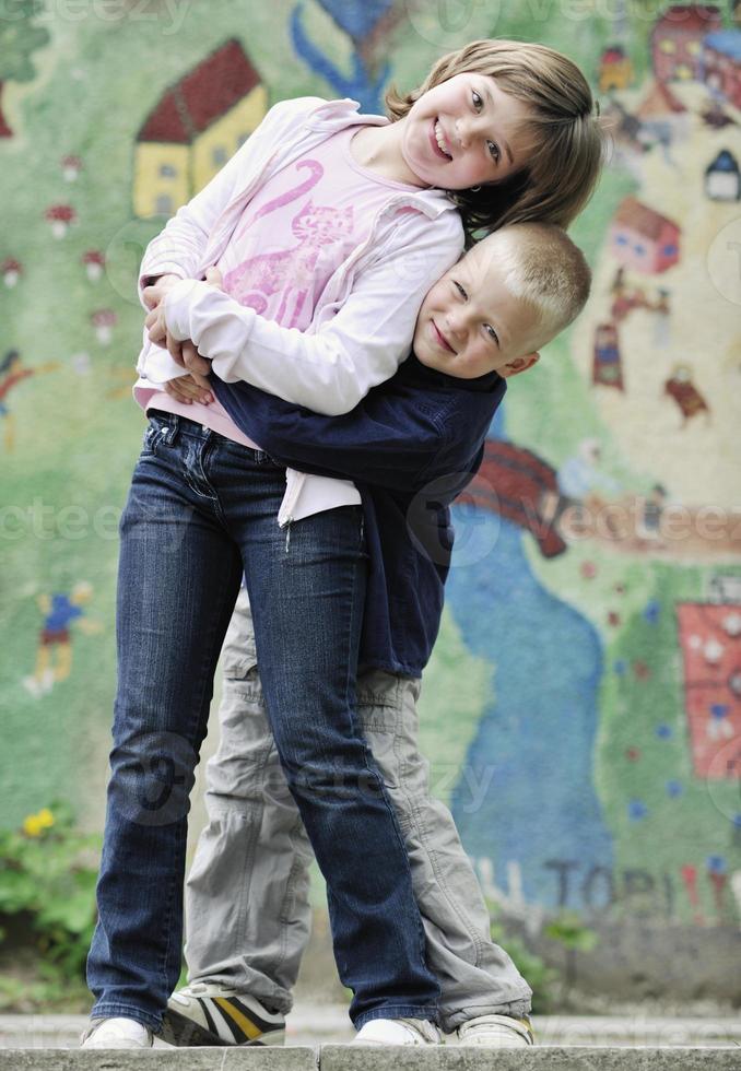 happy brother and sister outdoor in park photo