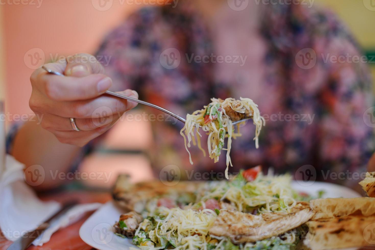 woman eat salad photo