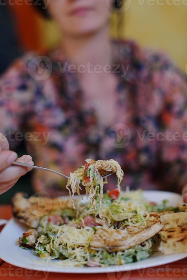 woman eat salad photo