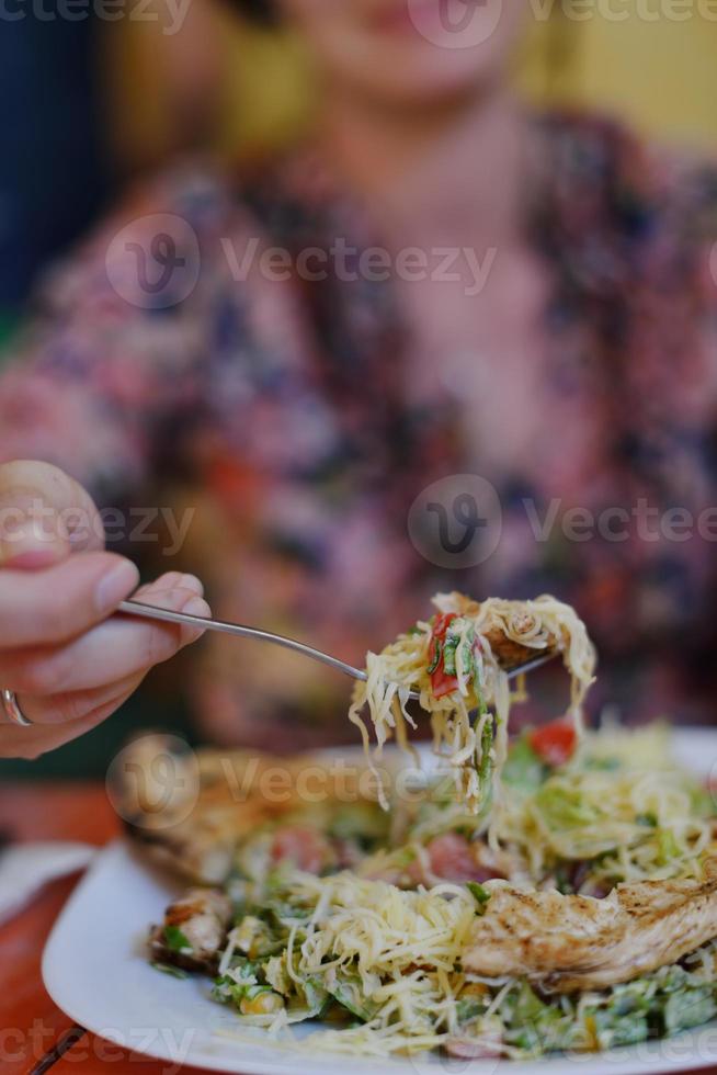 woman eat salad photo