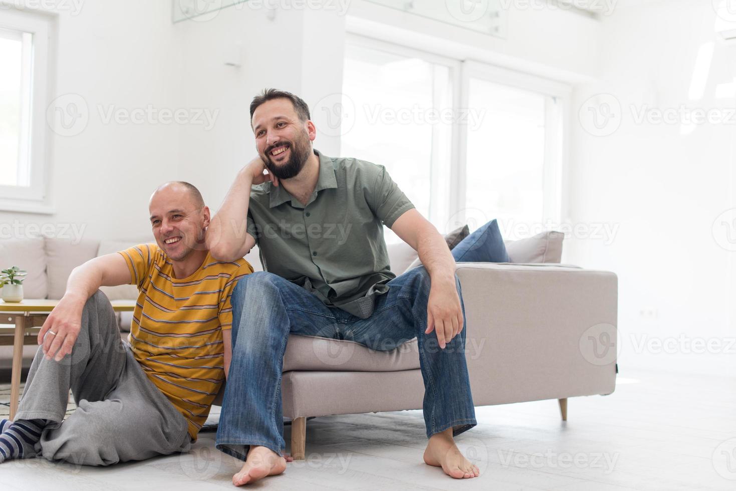 Portrait of male gay couple with adopted childre photo