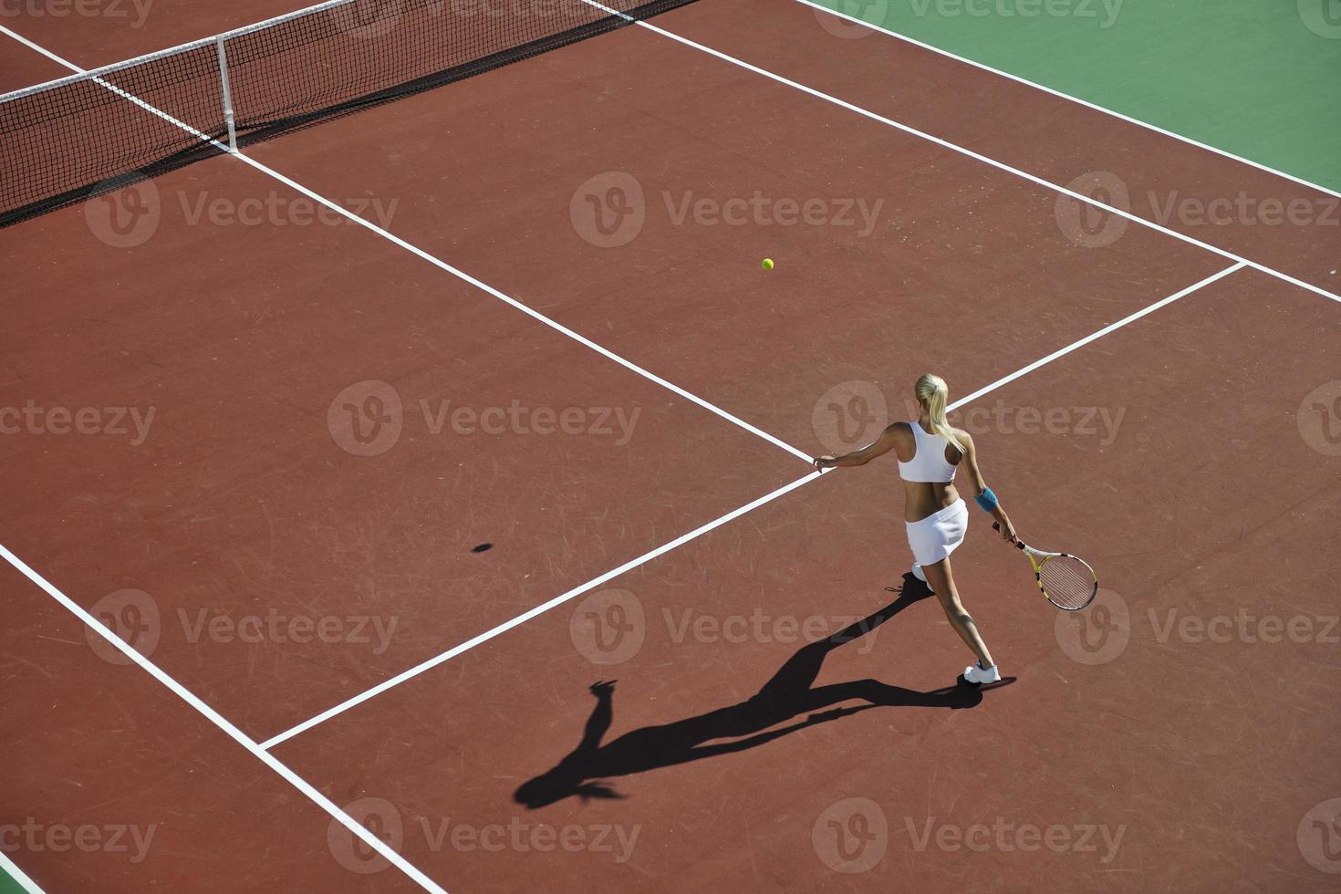 young woman play tennis photo