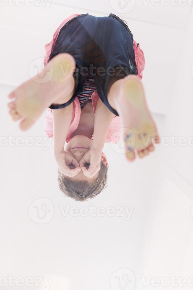 little boy standing on transparent glass floor photo