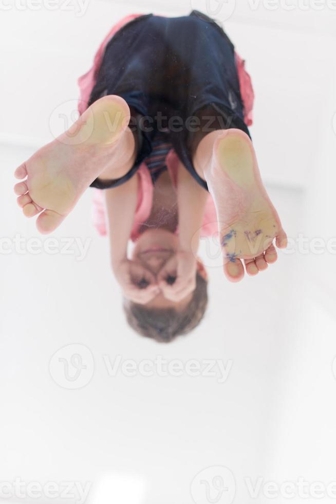 little boy standing on transparent glass floor photo