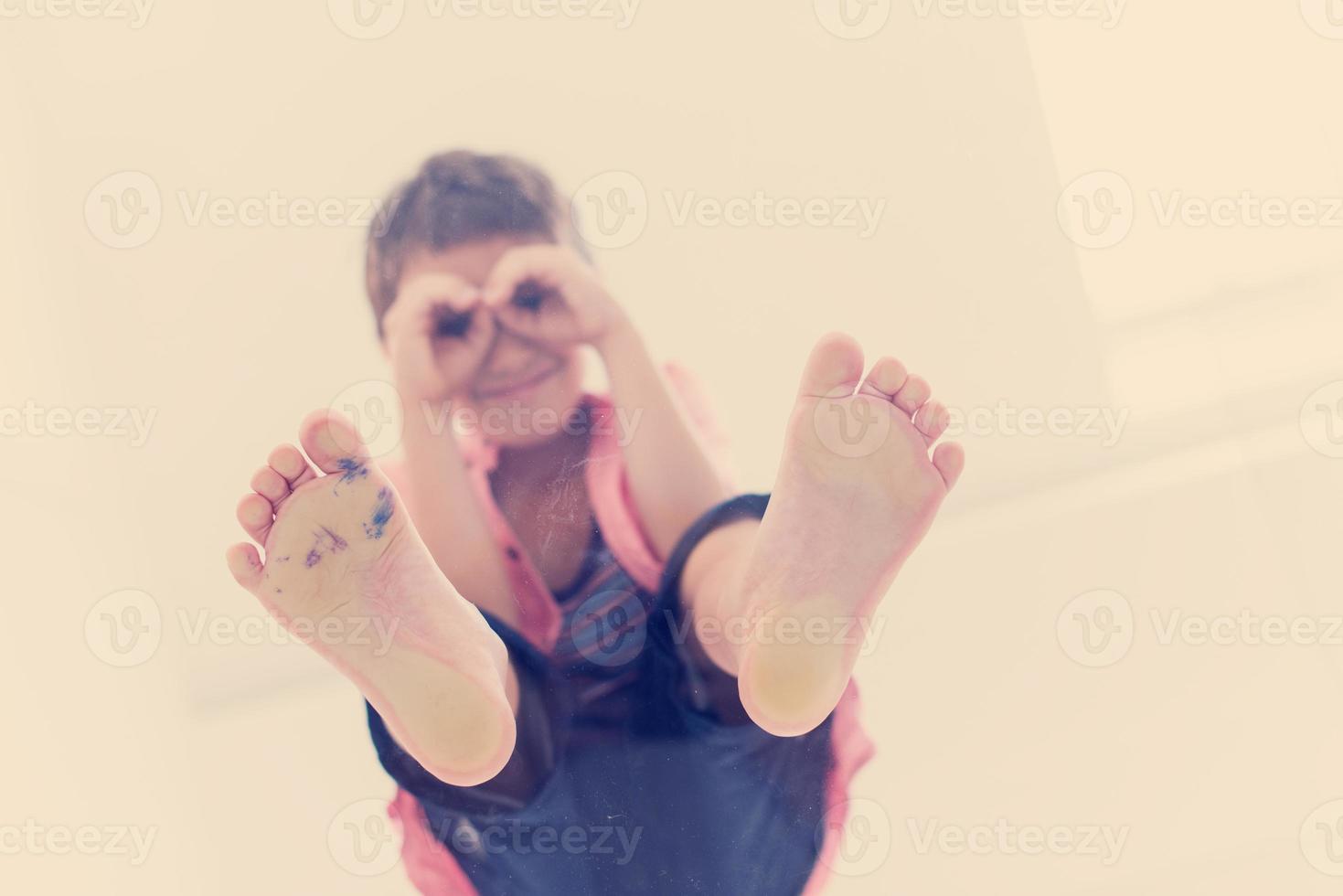 little boy standing on transparent glass floor photo