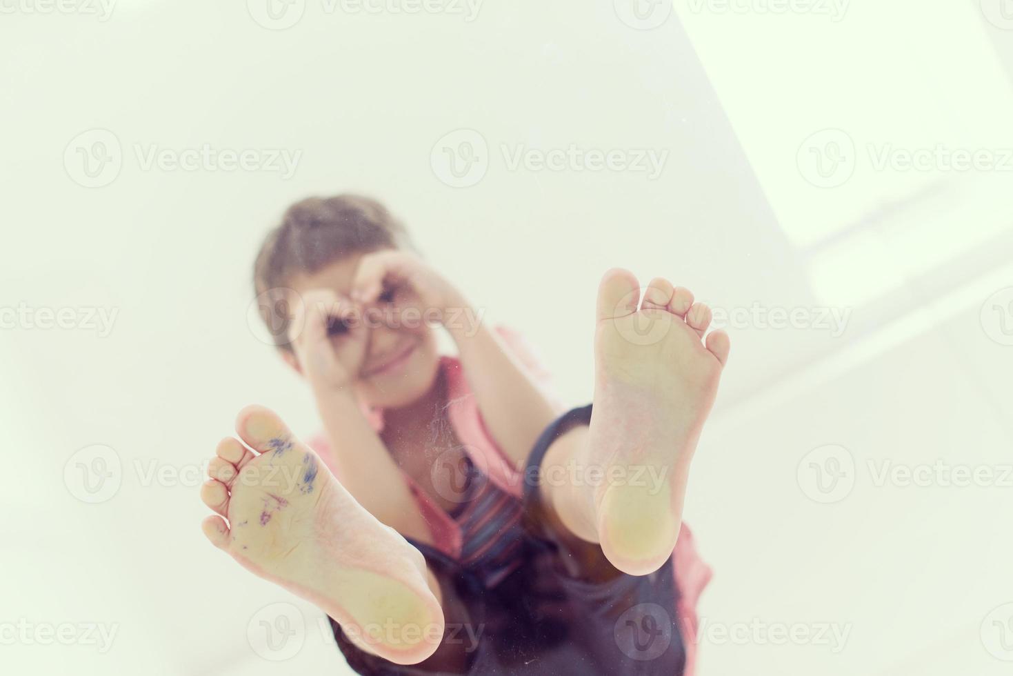 little boy standing on transparent glass floor photo