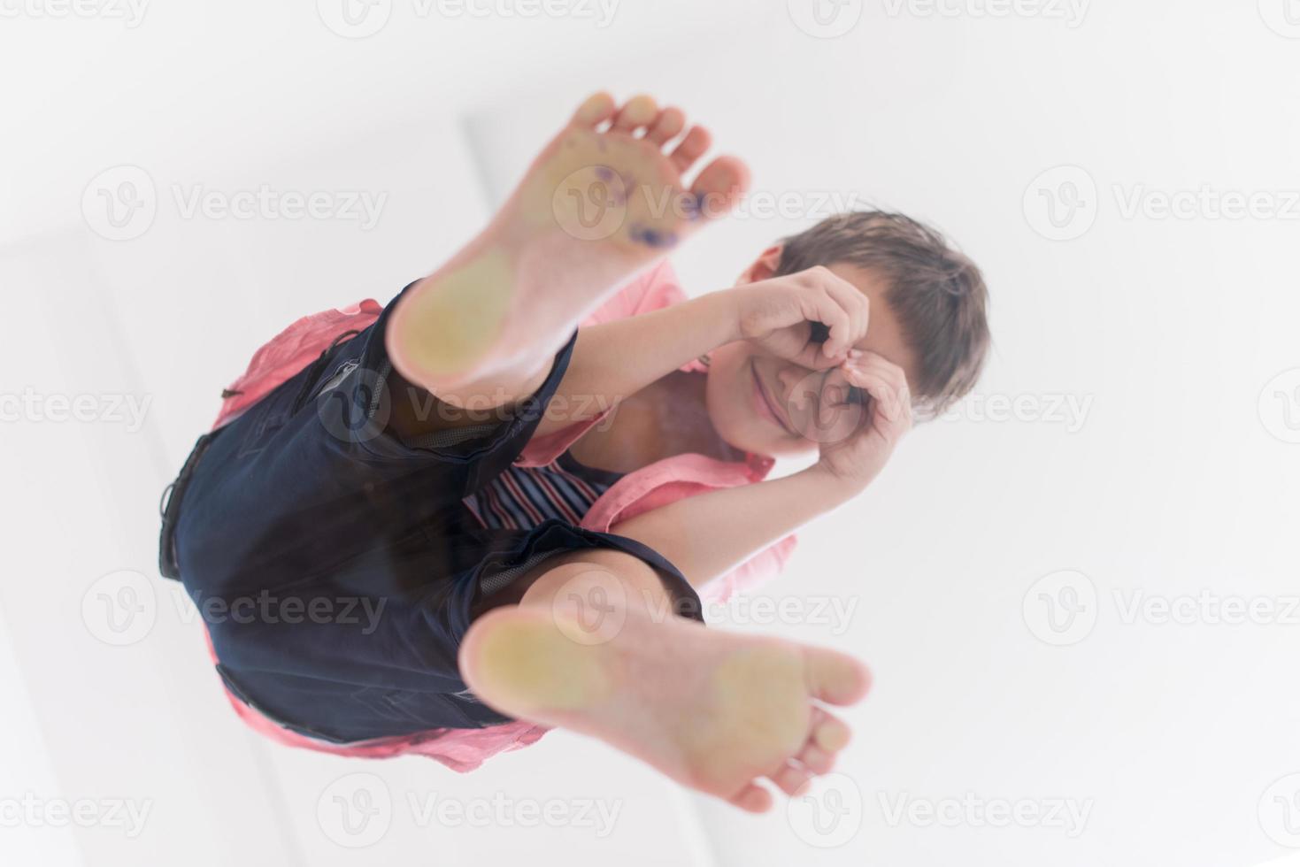 little boy standing on transparent glass floor photo