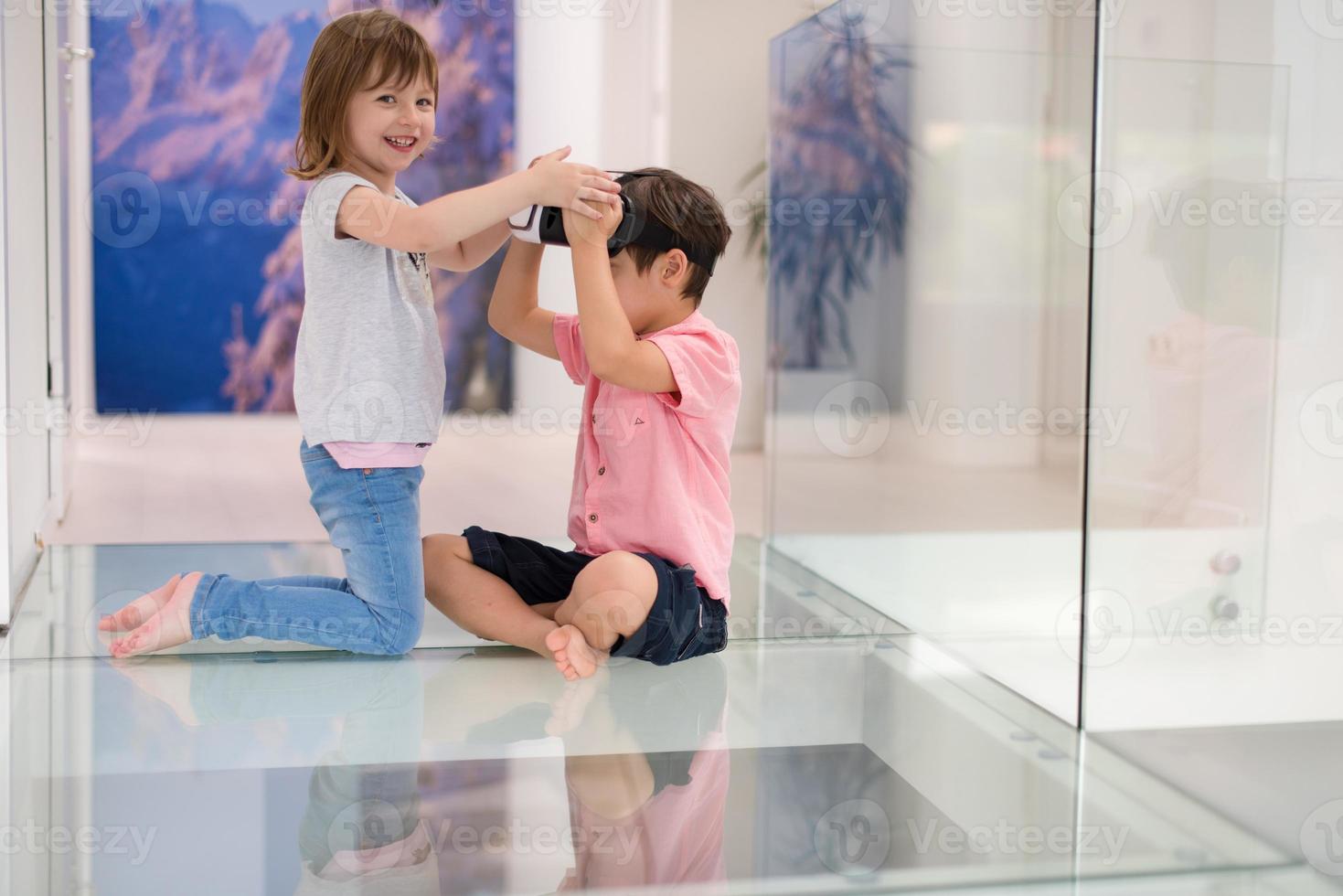 kids using virtual reality headsets at home photo