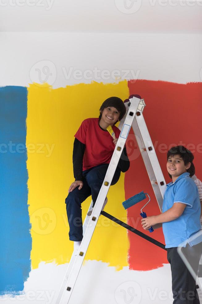 boys painting wall photo