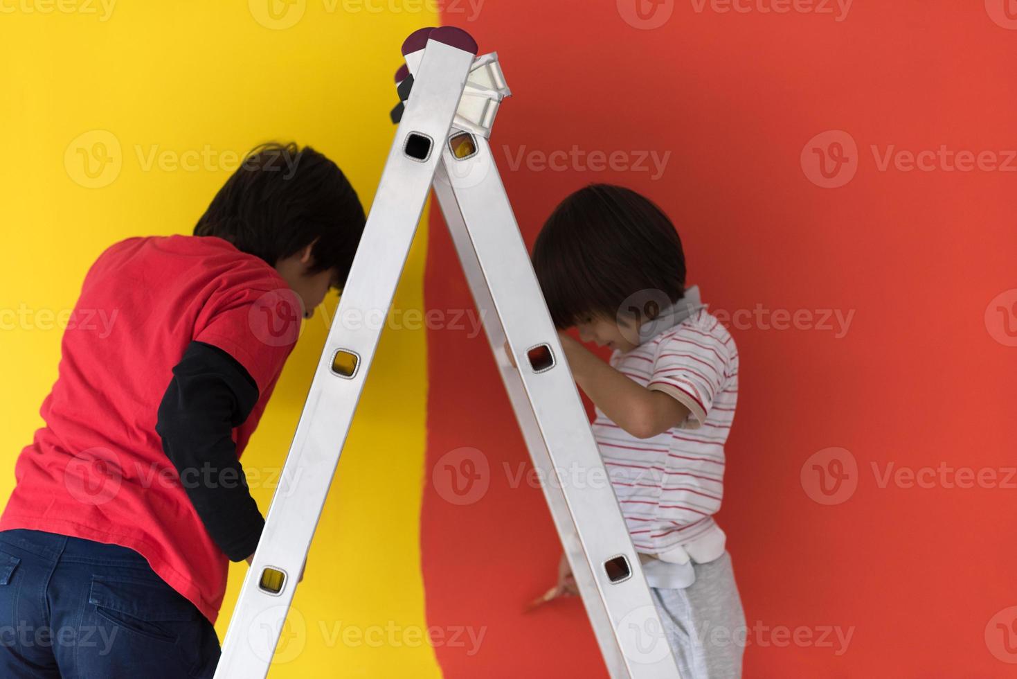 boys painting wall photo