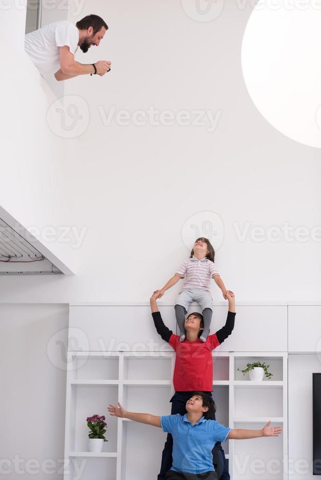 young boys posing line up piggyback photo