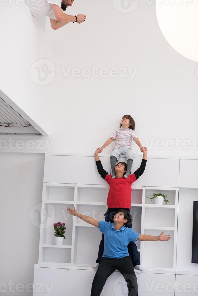 young boys posing line up piggyback photo