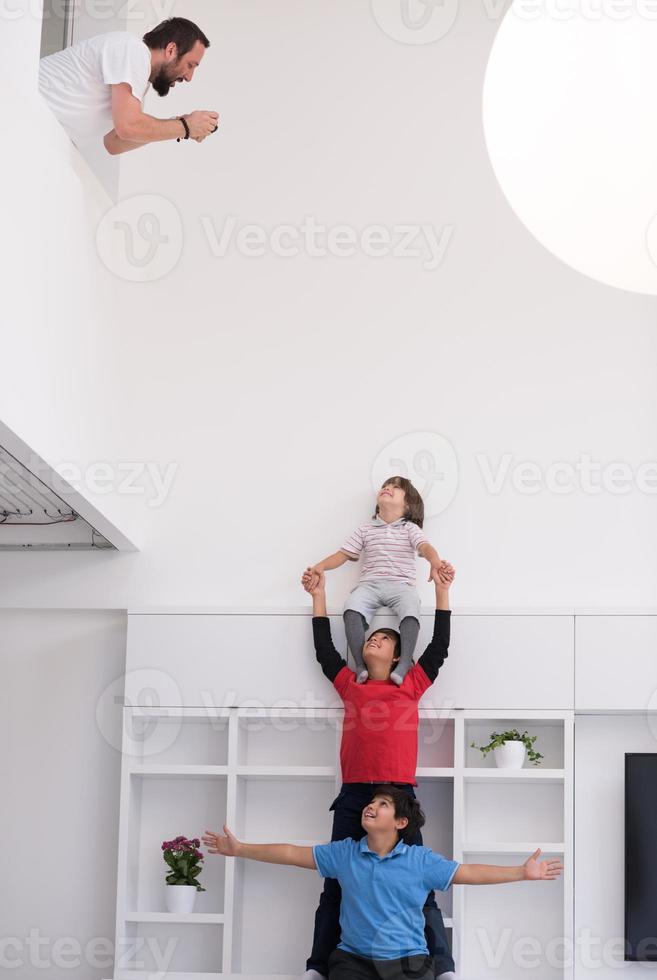 young boys posing line up piggyback photo