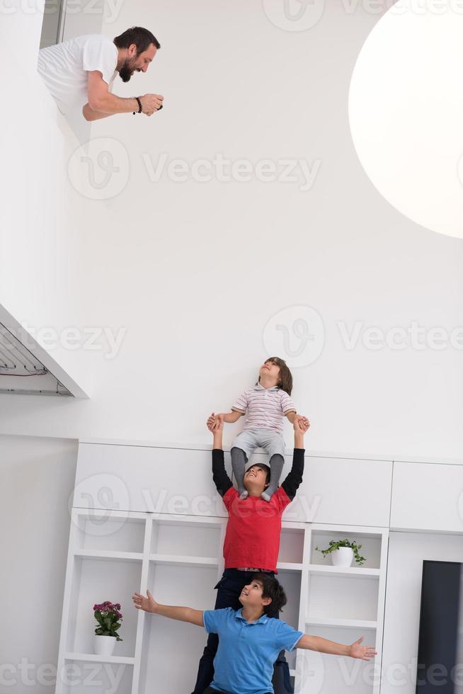 young boys posing line up piggyback photo