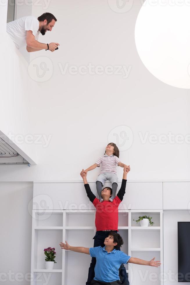 young boys posing line up piggyback photo