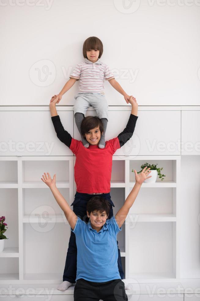 young boys posing line up piggyback photo