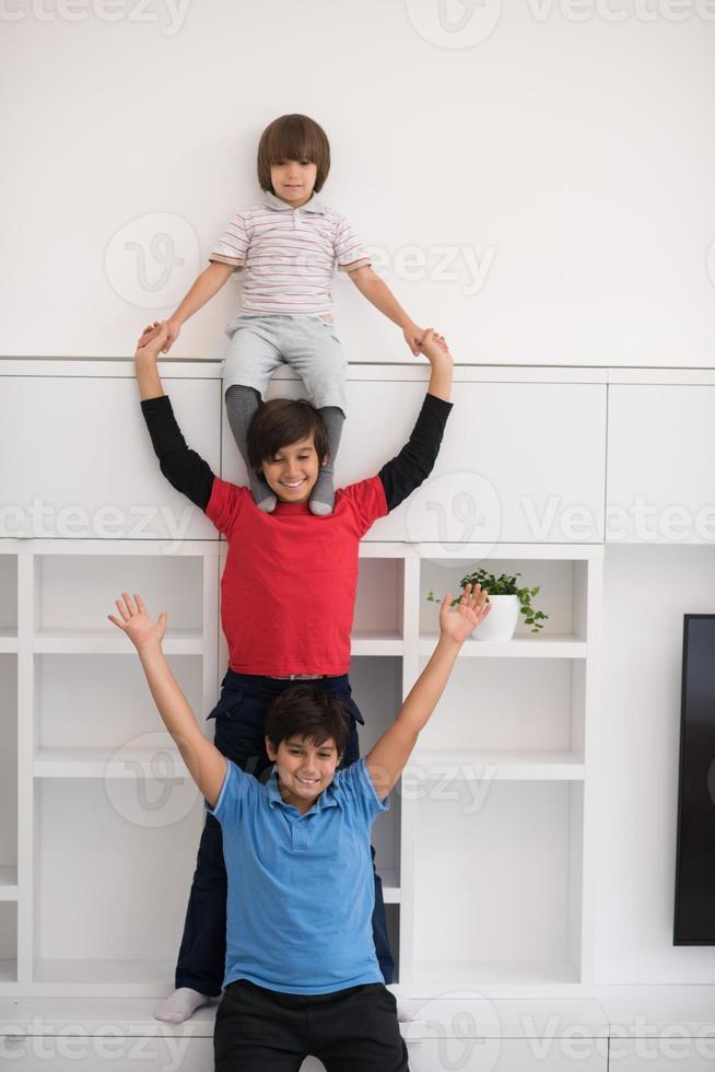 young boys posing line up piggyback photo